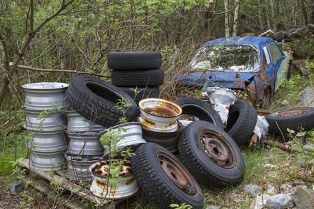 One problem that you come across again and again in the beautiful landscape of Norway is the wild disposal of bulky waste and scrap vehiclesの写真素材