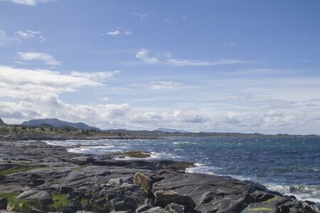A stormy day on the rocky Atlantic coast of the island of Tustna in central Norwayの写真素材