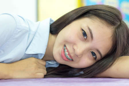 thai Woman blue Shirt smileの写真素材