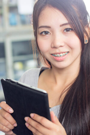 asia thai woman using tabletの写真素材