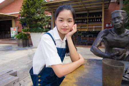 Portrait of thai student teen beautiful girl relax and smile.の写真素材