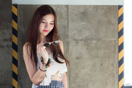 Portrait of thai adult beautiful girl relax time.の写真素材