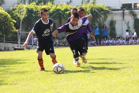 BANGKOK, THAILAND - NOV 19-20, 2015: Unknown children, student playing soccer at Pieamsuwan vitaya school, Bangkok Thailand.のeditorial素材