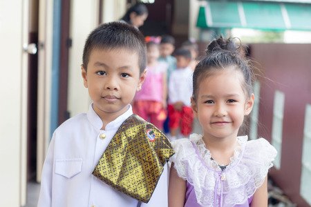 BANGKOK,THAILAND-NOVEMBER 25,2015: Cute girl in thai traditional costume in a carnival to celebrate the Loy Krathong Festival.のeditorial素材