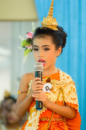 BANGKOK,THAILAND-NOVEMBER 25,2015: Cute girl in thai traditional costume in a carnival to celebrate the Loy Krathong Festival.のeditorial素材