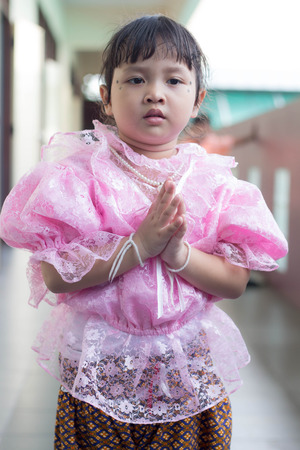 BANGKOK,THAILAND-NOVEMBER 25,2015: Cute girl in thai traditional costume in a carnival to celebrate the Loy Krathong Festival.のeditorial素材