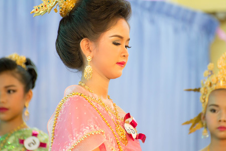 BANGKOK,THAILAND-NOVEMBER 25,2015: Cute girl in thai traditional costume in a carnival to celebrate the Loy Krathong Festival.のeditorial素材