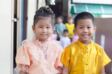 BANGKOK,THAILAND-NOVEMBER 25,2015: Cute girl in thai traditional costume in a carnival to celebrate the Loy Krathong Festival.のeditorial素材