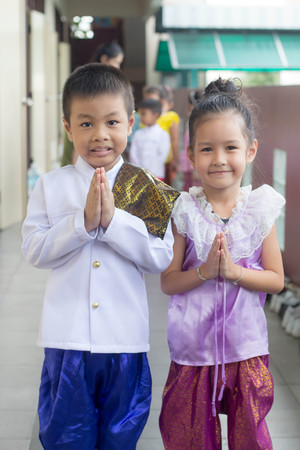 BANGKOK,THAILAND-NOVEMBER 25,2015: Cute girl in thai traditional costume in a carnival to celebrate the Loy Krathong Festival.のeditorial素材