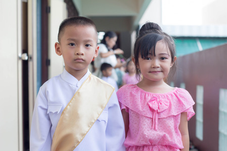 BANGKOK,THAILAND-NOVEMBER 25,2015: Cute girl in thai traditional costume in a carnival to celebrate...