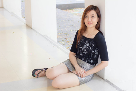 Portrait of thai adult beautiful girl relax and smileの写真素材