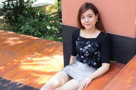 Portrait of thai adult beautiful girl relax and smileの写真素材