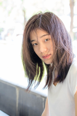 asia beautiful girl relax and looking at cameraの写真素材