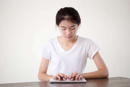 asia beautiful girl using her tabletの写真素材
