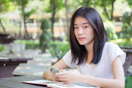 asia beautiful girl using her smart phone.