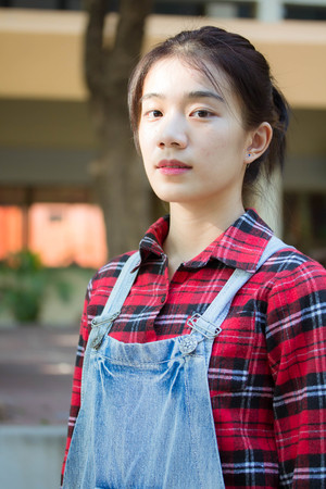 asia thai teenager Women Scotch T-Shirt relax and smileの写真素材