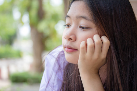 Portrait of thai student High School beautiful girl relax and smileの写真素材