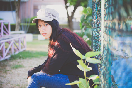 asia thai teenager Women black T-Shirt relax and smileの写真素材