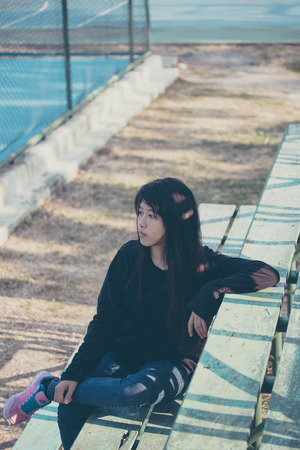 asia thai teenager Women black T-Shirt relax and smileの写真素材