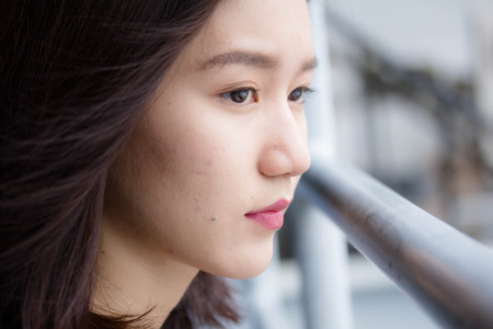 Portrait of thai adult beautiful girl relax and smileの写真素材