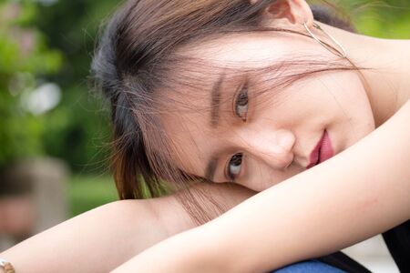 Portrait of thai adult beautiful girl relax and smileの写真素材