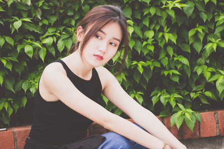 Portrait of thai adult beautiful girl relax and smileの写真素材