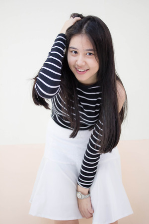 Portrait of thai teen beautiful girl relax and smileの写真素材