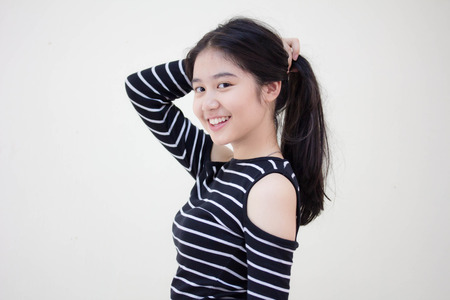 Portrait of thai teen beautiful girl relax and smileの写真素材