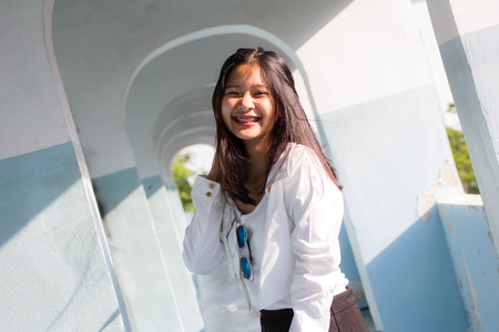 Portrait of thai teen beautiful girl relax and smileの写真素材
