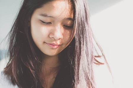 Portrait of thai teen beautiful girl relax and smileの写真素材