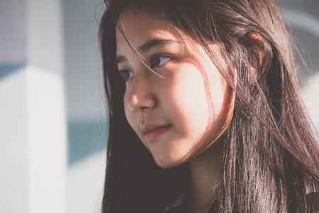 Portrait of thai teen beautiful girl relax and smileの写真素材