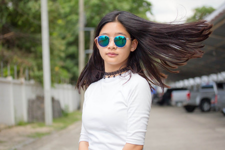 Portrait of thai teen beautiful girl relax and smileの写真素材