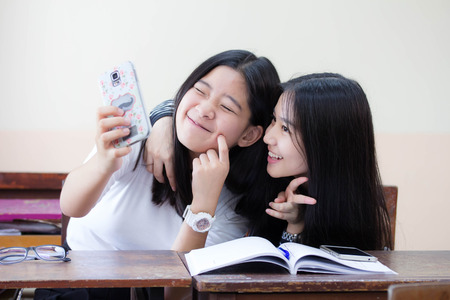 two asia thai teen Best friends girls make picture selfie picの写真素材
