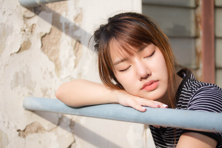 Portrait of thai adult beautiful girl relax and smileの写真素材