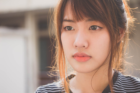 Portrait of thai adult beautiful girl relax and smileの写真素材