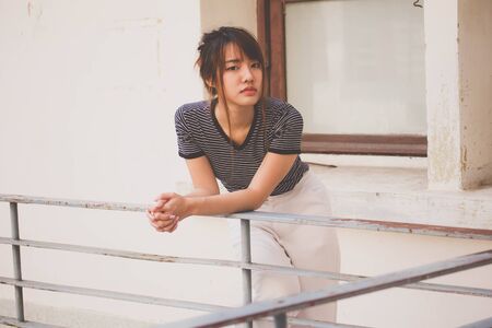 Portrait of thai adult beautiful girl relax and smileの写真素材