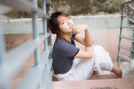 Portrait of thai adult beautiful girl relax and smileの写真素材
