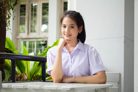 Portrait of thai high school student uniform teen beautiful girl happy and relaxの写真素材