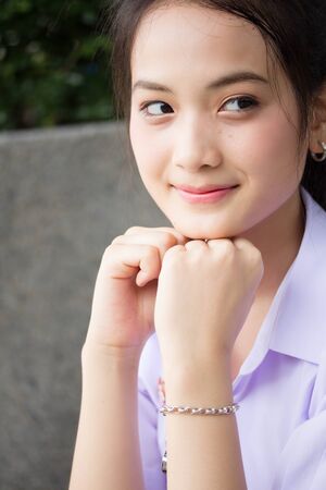 Portrait of thai high school student uniform teen beautiful girl happy and relaxの写真素材