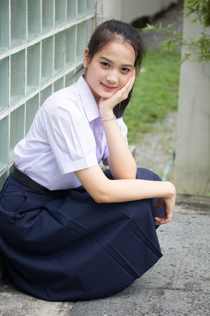 Portrait of thai high school student uniform teen beautiful girl happy and relaxの写真素材