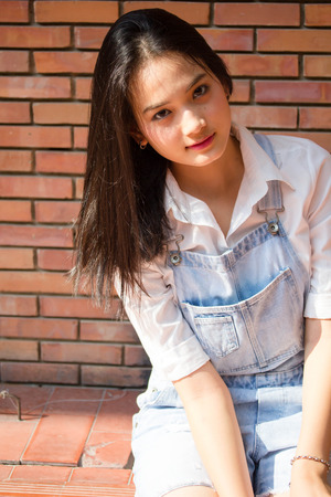 Portrait of thai teen beautiful girl happy and relaxの写真素材
