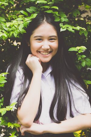 Portrait of thai high school student uniform teen beautiful girl happy and relaxの写真素材
