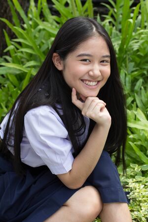 Portrait of thai high school student uniform teen beautiful girl happy and relaxの写真素材