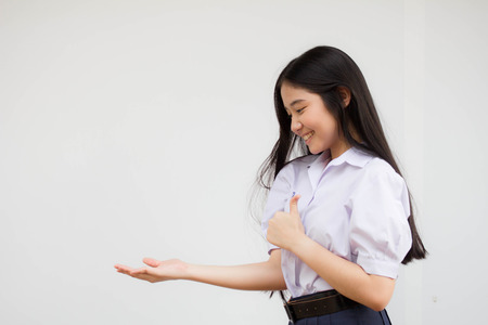 Portrait of thai high school student uniform teen beautiful girl happy and relaxの写真素材