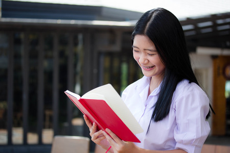 asia thai high school student uniform beautiful girl read a book