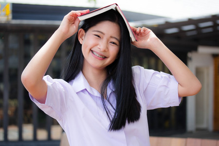 asia thai high school student uniform beautiful girl read a bookの写真素材