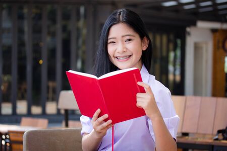 asia thai high school student uniform beautiful girl read a bookの写真素材