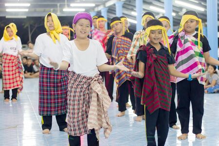 Student 11-12 years old, Scout activities, dance performances around the fire., TeePangKorn Scout Camp in Samut Sakhon Thailand.のeditorial素材