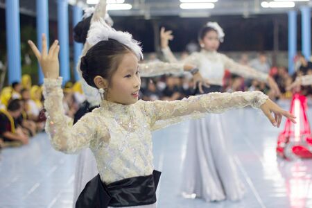 Student 11-12 years old, Scout activities, dance performances around the fire., TeePangKorn Scout Camp in Samut Sakhon Thailand.のeditorial素材