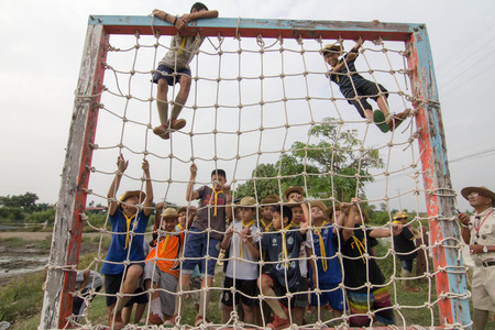 Student 11-12 years old, Scout in adventure activities, TeePangKorn Scout Camp in Samut Sakhon Thailand.のeditorial素材